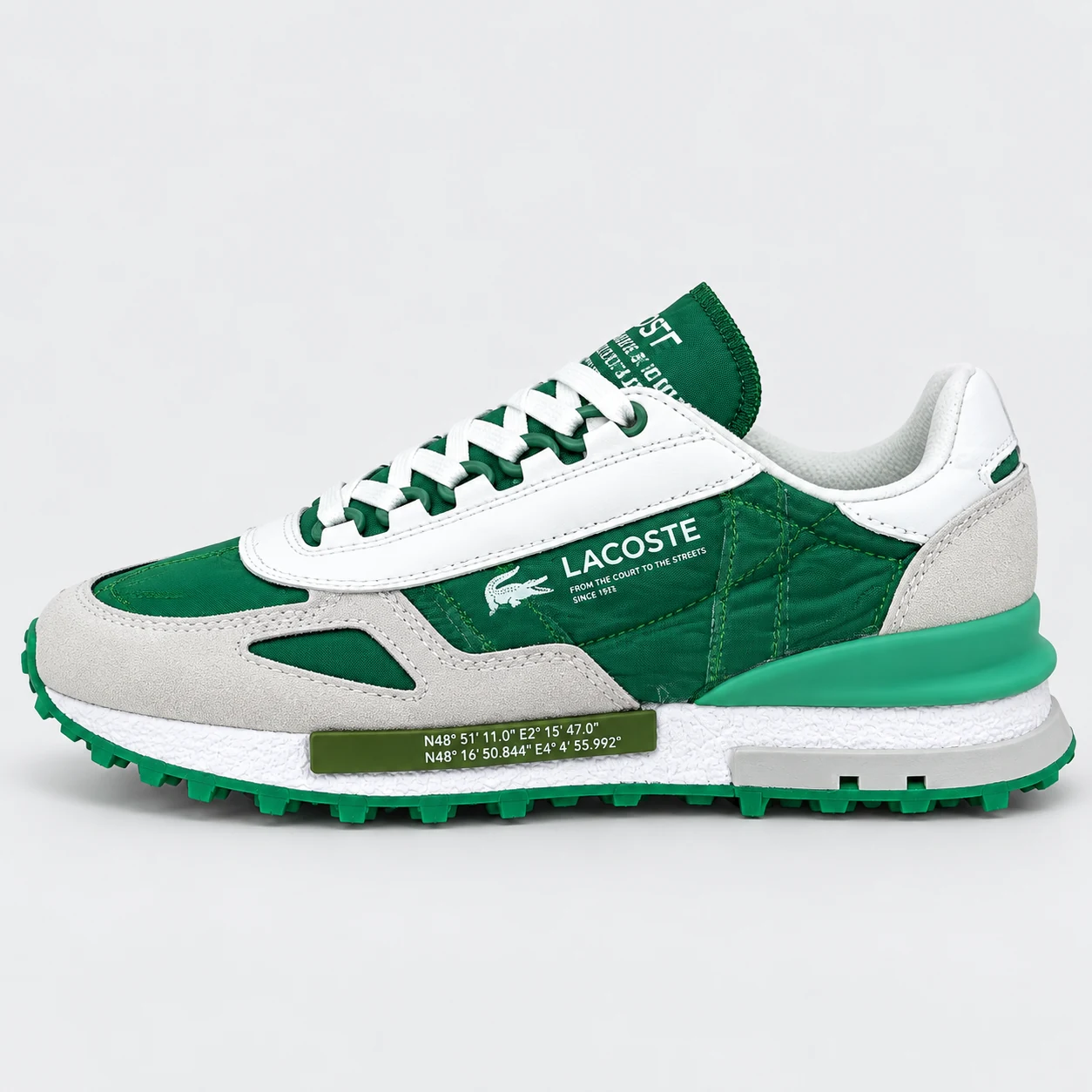 Lacoste Low-Top Runner — Green / White / Light Grey A green and white low-top sneaker with quilted side panels, light grey overlays, white laces and a sculpted green and white sole. Choose a UK size from 3 to 9 and view the product photos at The Drip Society.
